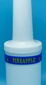 A bottle of pineapple juice with blue band around it.