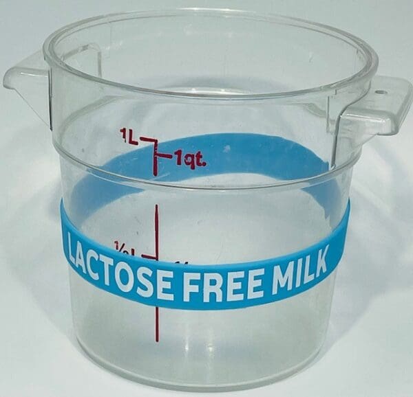 A plastic container with the words " lactose free milk ".