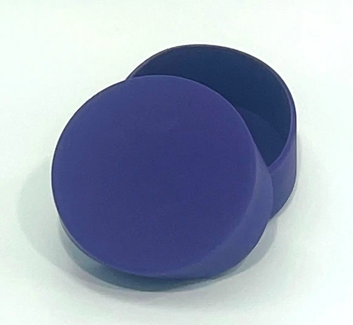 A blue round box sitting on top of a table.