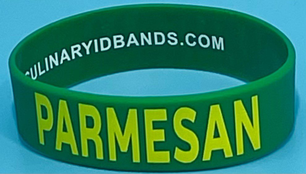 A green and yellow bracelet with the word " parmesan ".