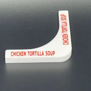 Chicken Tortilla Soup label on black background.