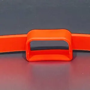 Orange plastic banana slicer on gray background.