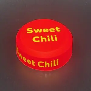 Red sweet chili sauce container lid.