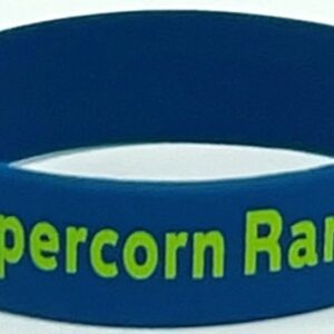 A blue wristband with the words " supercorn ranch ".