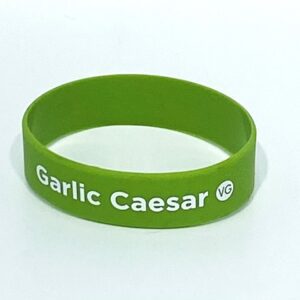 Green bracelet with "Garlic Caesar" text.