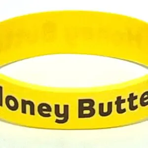 A yellow bracelet with the words honey butter on it.