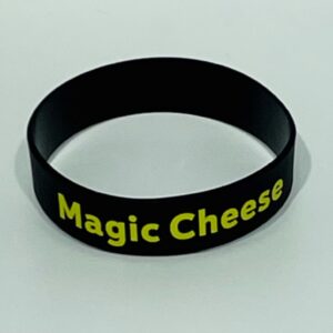 Black wristband with "Magic Cheese" text.