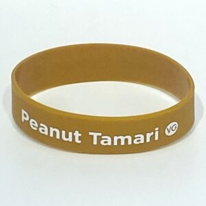 Brown wristband with "Peanut Tamari" text.