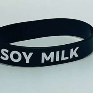 Black wristband with "SOY MILK" text.