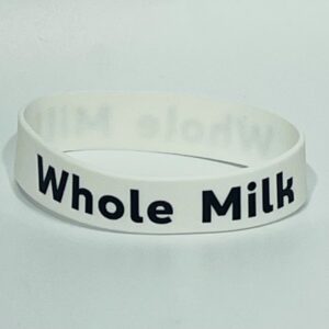 White wristband with "Whole Milk" text.