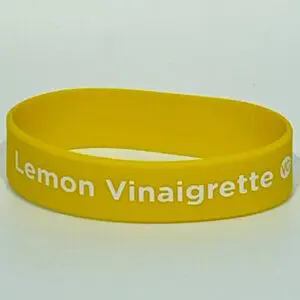 Yellow wristband with "Lemon Vinaigrette" text.