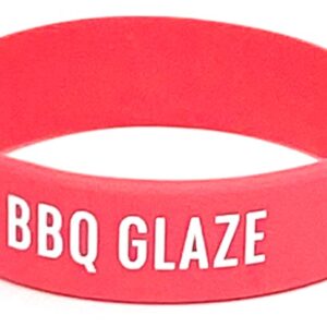 A red wristband with the words bbq glaze written on it.