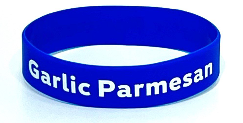 A blue bracelet with the words garlic parmer on it.