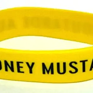 A yellow wristband with the words honey mustard written on it.
