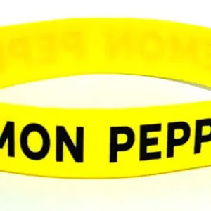 A yellow rubber bracelet with the words " lemon pepper ".