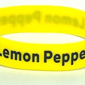 A yellow rubber bracelet with the words " lemon pepper ".