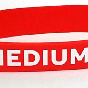 A red wristband with the word medium written on it.