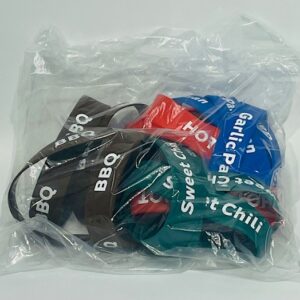 A bag of bbq sauce and other items.