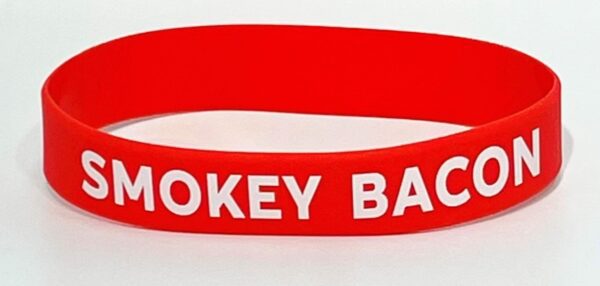 A red hockey bracelet with the words " hockey back ".