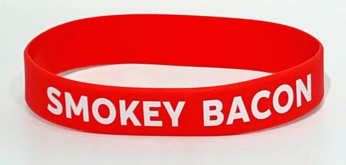 A red hockey bracelet with the words " hockey back ".