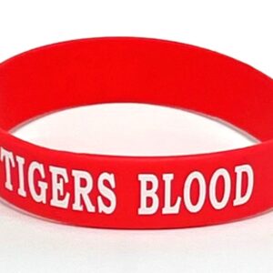 Red wristband with "TIGERS BLOOD" text.