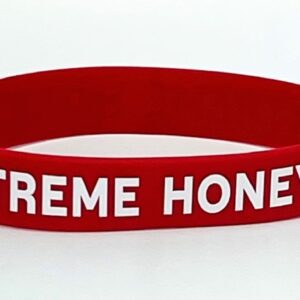 Red wristband with "EXTREME HONEY" text.