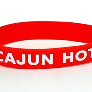 Red wristband with "Cajun Hot" text.