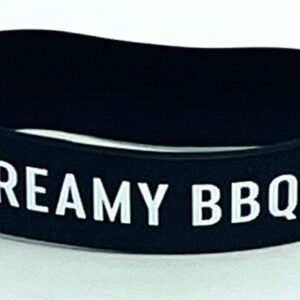 A black and white bracelet with the words creamy bbq written on it.