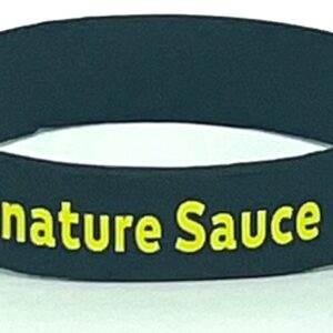A black wristband with the words " signature sauce ".