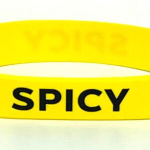Yellow wristband with "SPICY" text.