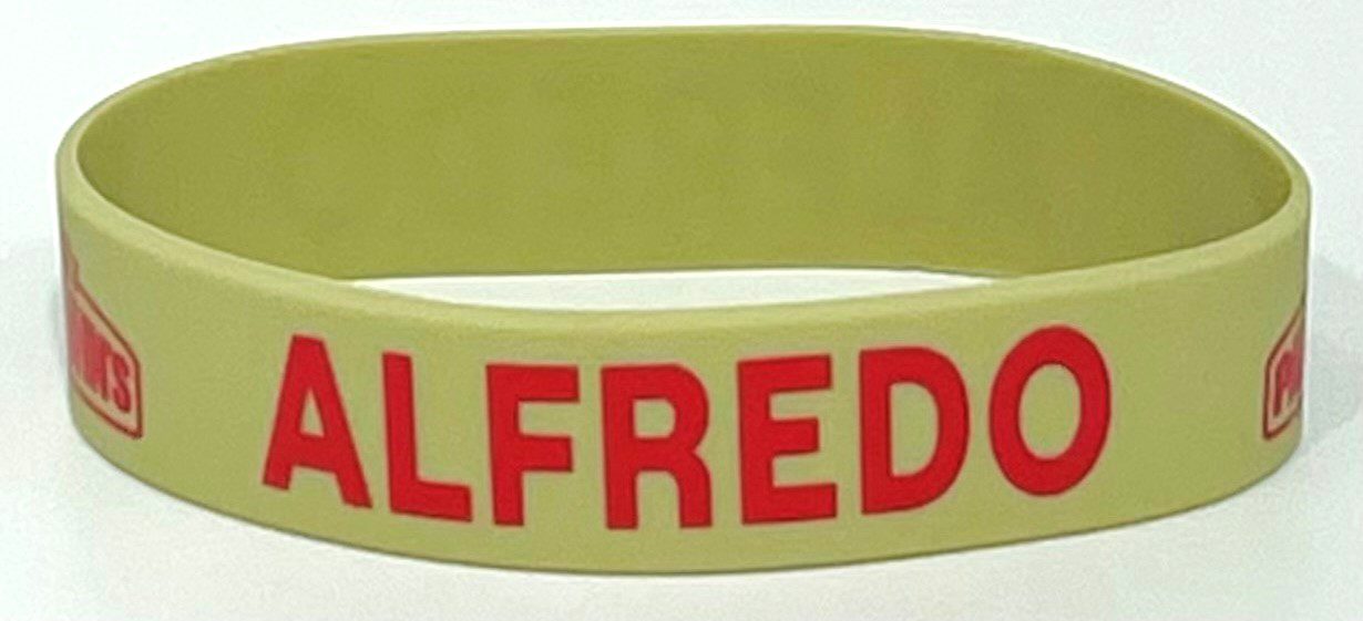 A close up of the name of a person on a bracelet