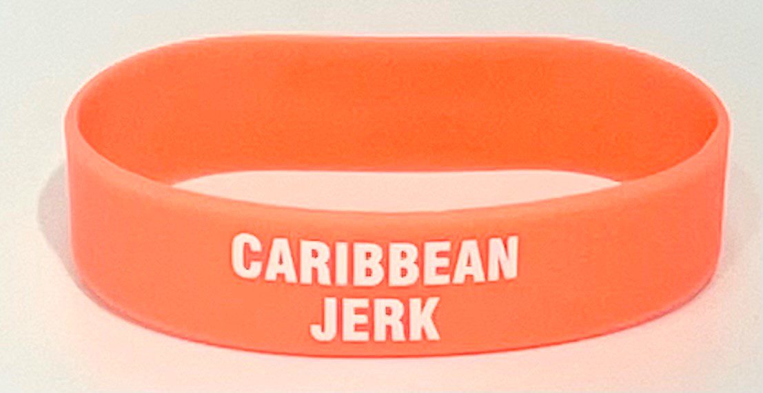 A close up of the side of an orange wristband