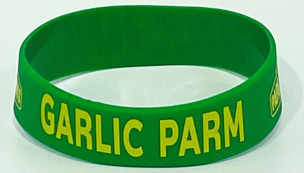 A green and yellow bracelet with the words garlic parmesan on it.