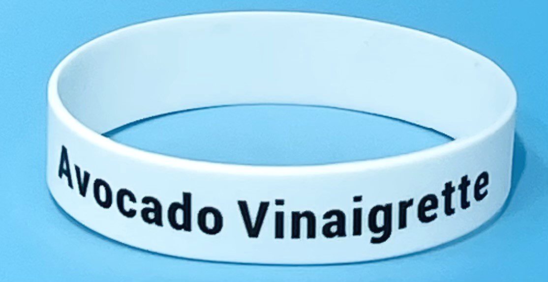 A white bracelet with the words " mercado vinaigru ".