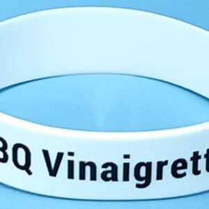 A white bracelet with the words bbq vinaigrette on it.