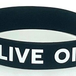 A black and white wristband with the words live on.