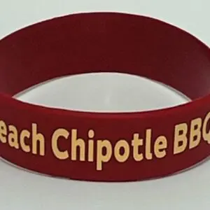 A red bracelet with the words " beach chipotle bbq ".