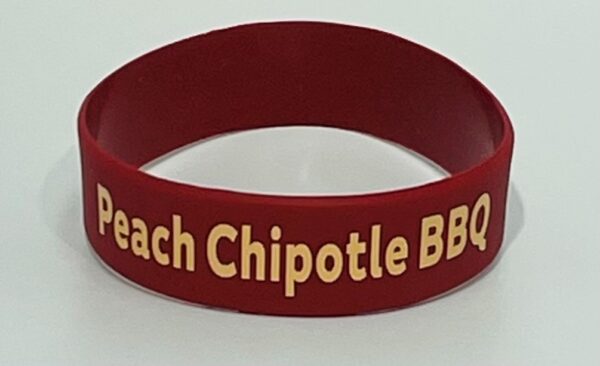 A red bracelet with the words " beach chipotle bbq ".