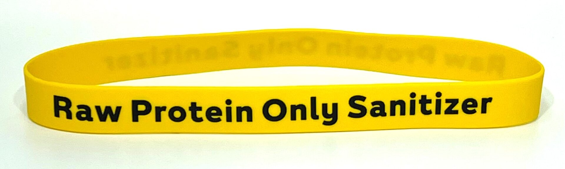 A yellow bracelet with the words " protein only serves ".