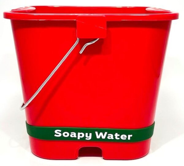 A red bucket with the words soapy water on it.