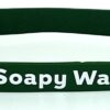 A green rubber bracelet with the words soapy water on it.