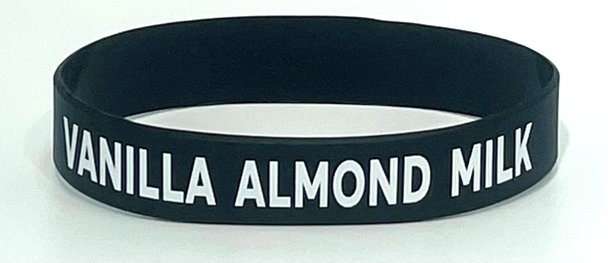 A black bracelet with the words " la almond " written on it.