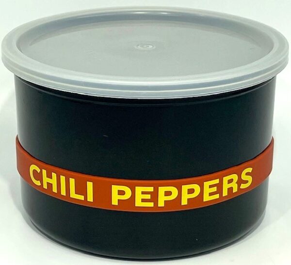 A black container with chili peppers written on it.