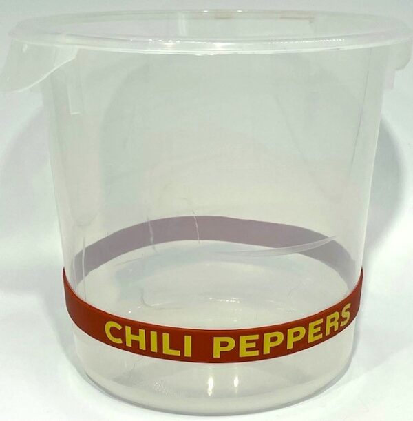 A chili peppers container with the lid off.