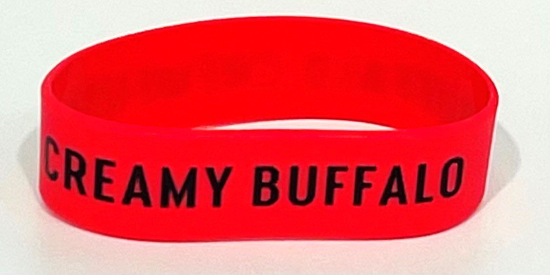 A red wristband with the name amy buffalo written on it.