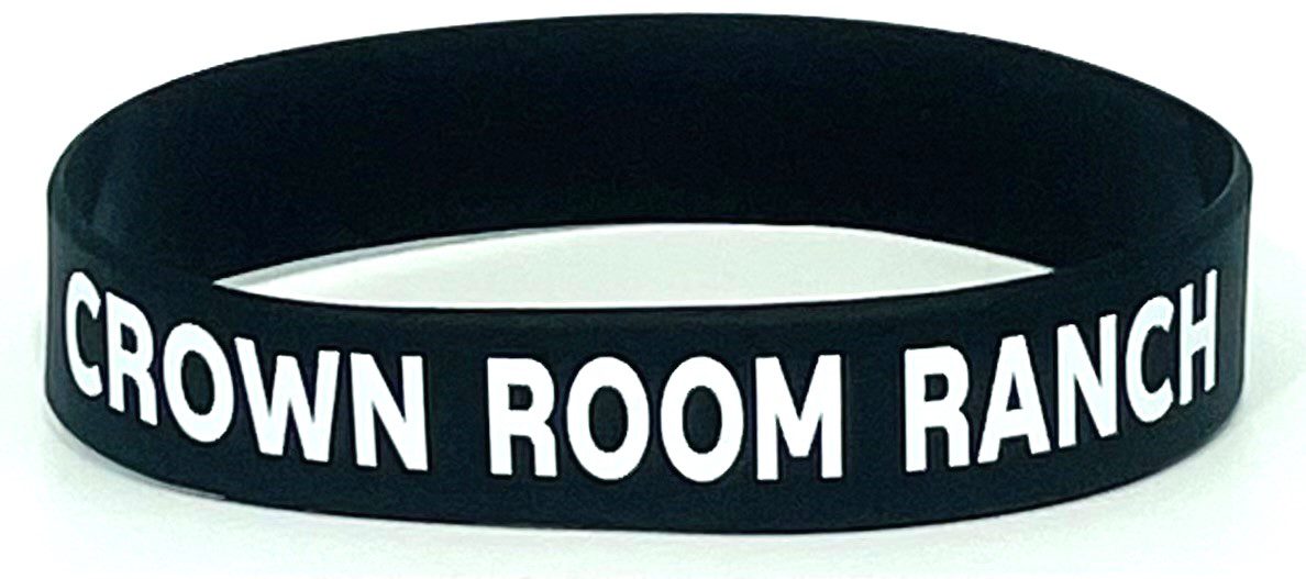 A black wristband with the words " room for rent ".