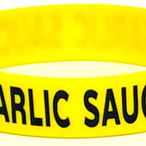 A yellow bracelet with the words garlic sauce written on it.