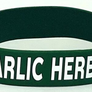A green bracelet with the words garlic here on it.