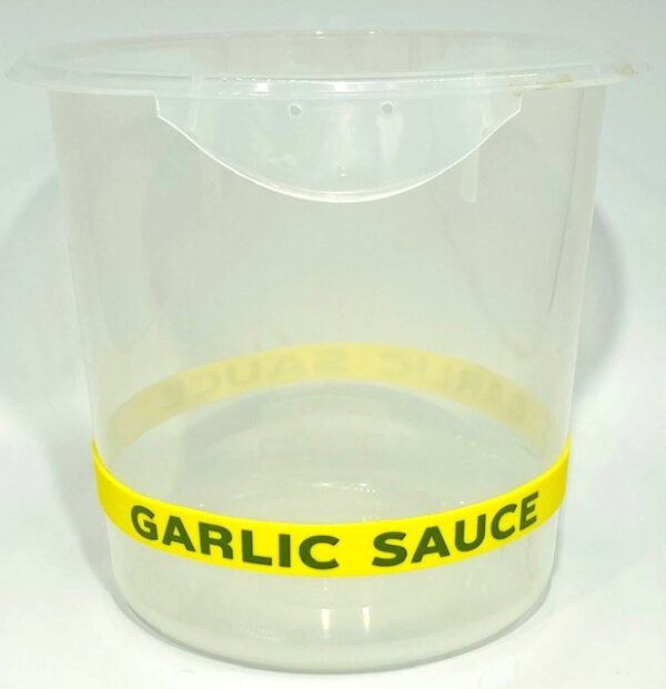 A plastic container with the words garlic sauce on it.