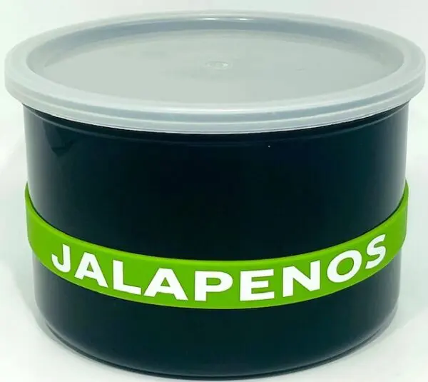 A container of jalapenos with the word " jalapenos " written on it.